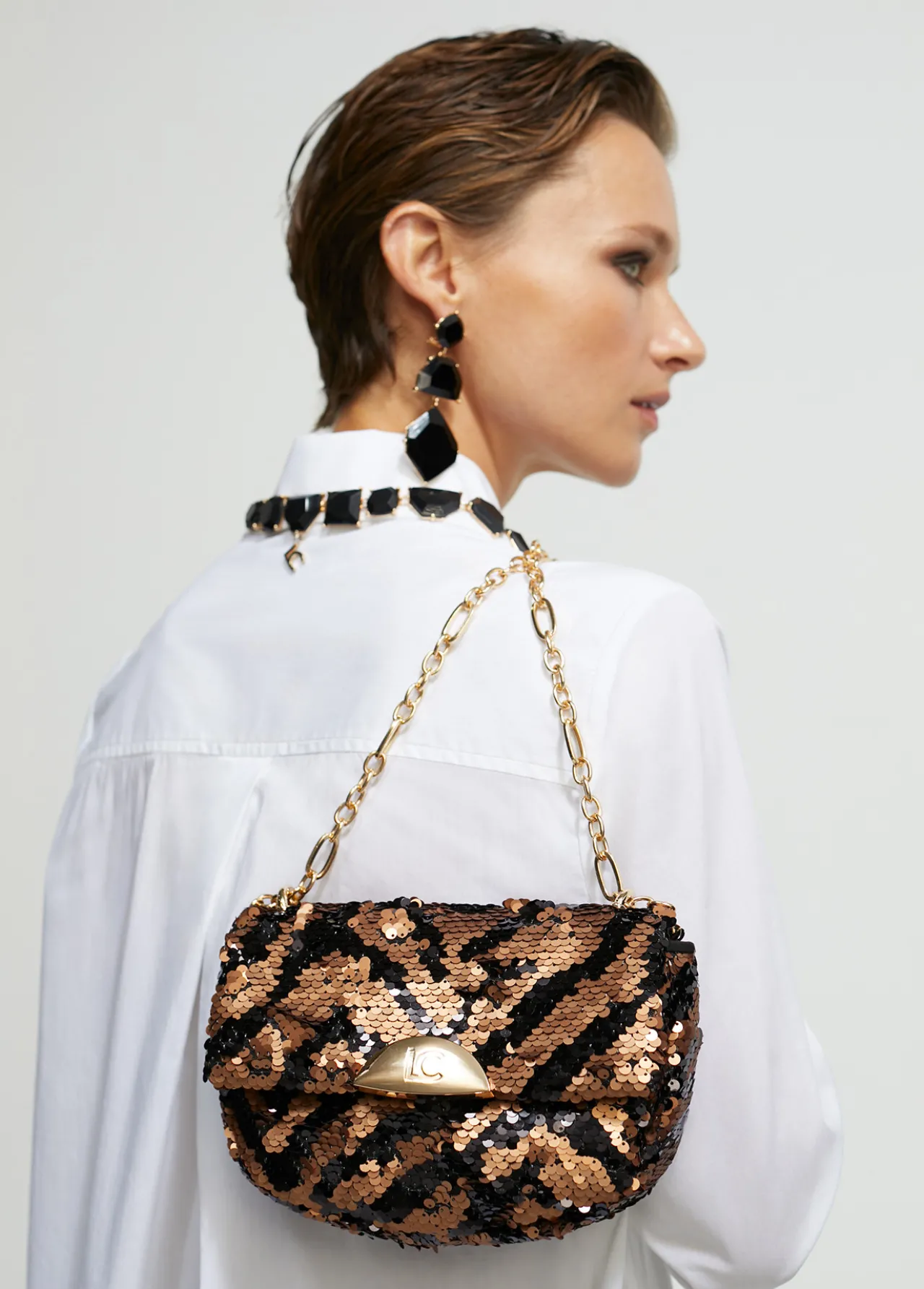bandolera_lentejuelas_0.webp Lola Casademunt Animal Print | Bandoleras<Bandolera lentejuelas MARRON-NEGRO